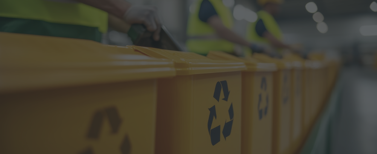 yellow recycling cans in a row